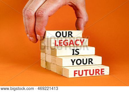 Legacy And Future Symbol. Concept Words Our Legacy Is Your Future On Wooden Blocks. Beautiful Orange