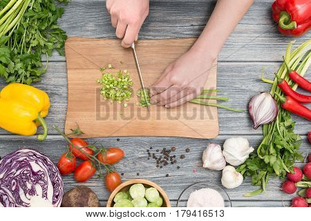 cooking chef chop cut food prepare vegetables women salad cutting chopping mediterranean home kitchen people hand board concept