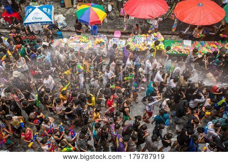 Bangkok, Thailand - April 13, 2014 : The Songkran festival or Thai New Year's festival on Silom street in Bangkok, Thailand.