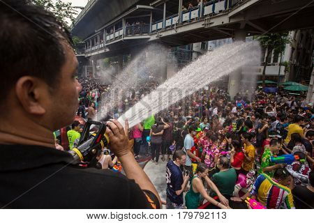 Bangkok, Thailand - April 13, 2014 : The Songkran festival or Thai New Year's festival on Silom street in Bangkok, Thailand.