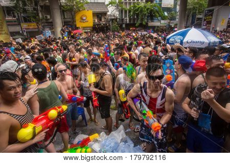 Bangkok, Thailand - April 13, 2014 : The Songkran festival or Thai New Year's festival on Silom street in Bangkok, Thailand.