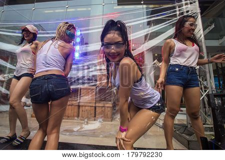 Bangkok, Thailand - April 13, 2014 : The Songkran festival or Thai New Year's festival on Silom street in Bangkok, Thailand.