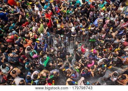 Bangkok, Thailand - April 13, 2014 : The Songkran festival or Thai New Year's festival on Silom street in Bangkok, Thailand.