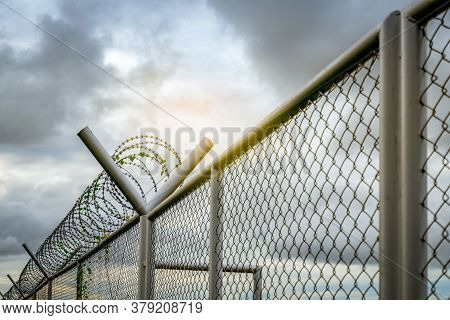 Prison Security Fence. Barbed Wire Security Fence. Razor Wire Jail Fence. Barrier Border. Boundary S