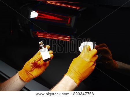 Car Polish Wax Worker Hands Polishing Car. Buffing And Polishing Vehicle With Ceramic. Car Detailing