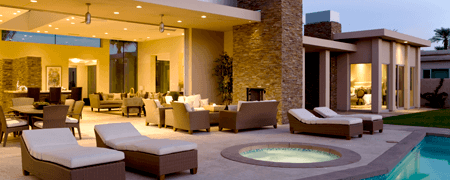 Poolside view of the interior living space of a modern upscale home open concept lanai style.