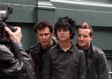 Michael Ryan Photo - New York NY 5-16-09 EXCLUSIVEThree time Grammy Award winning group Green Day (Billy Joe Armstrong (c) Tres Cool (Frank Edwin Wright III) (r) and Michael Ryan Pritchard (Dirnt) (l) jump out of a van for a quick private photo shoot wih their own photographer outside the Prada store in SoHoEXCLUSIVE Digital photo by Jamie Scull-PHOTOlinknet