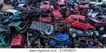 Old Rusty Corroded Cars In Car Scrapyard.