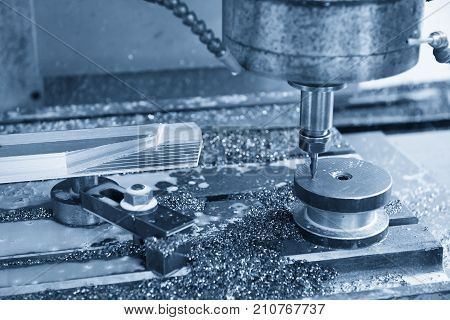 The CNC milling machine cutting cutting the raw material with the indexable tool .Hi-precision CNC machining concept.