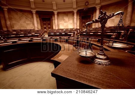 Symbol of law and justice in the empty courtroom law and justice concept.