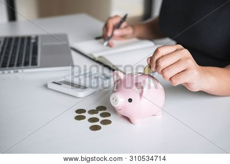 Woman Putting Golden Coin In Pink Piggy Bank For Step Up Growing Business To Profit And Saving With 