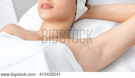 Elos Epilation Hair Removal Procedure On A Woman's Body. Beautician Doing Laser Rejuvenation In A Be