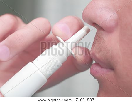 Man Uses A Nasal Spray