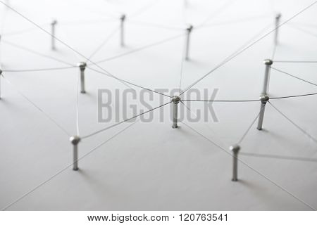 Linking entities. Network, networking, social media, connectivity, internet communication abstract. Web of thin silver wires on white background.