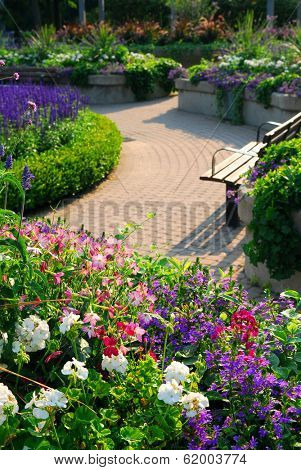 Formal garden with blooming flowers in the summer