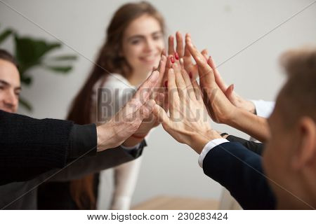 Motivated Successful Business Team Giving High Five, Happy Young Students Employees Group Join Hands