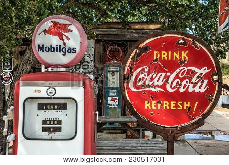 Hackberry, Arizona, Usa - May 19, 2016 : Retro Gas Pump And A Rusty Coca-cola Sign  On Historic Rout