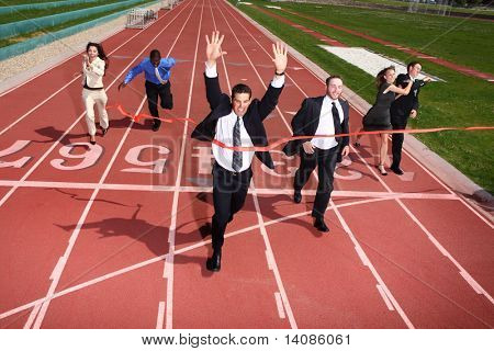 Businesspeople crossing the finish line