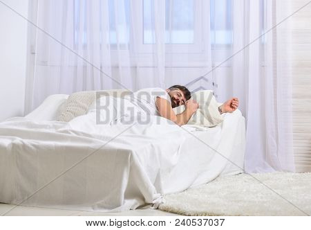 Guy On Calm Face Sleeping On White Sheets, Pillow.man Laying On Bed, Covered With Blanket, White Cur