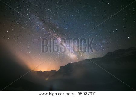 Idyllic Milky Way With Clouds And Fog In The Alps