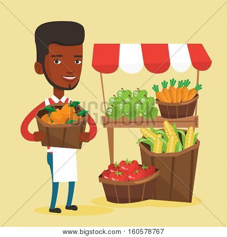 An african greengrocer standing near stall with fruits and vegetables. Greengrocer standing near market stall. Greengrocer holding basket with fruits. Vector flat design illustration. Square layout.