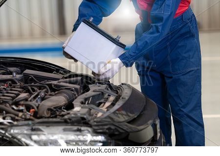 Car Mechanic Is Changing Car Battery, Male Engineer Is Changing Car Battery Because Car Battery Is D