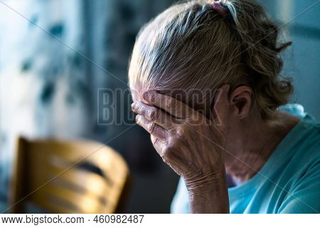 Sad Senior Old Woman. Lonely From Loss Or Sick With Headache. Upset Patient In Retirement Home With 