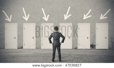 Businessman Choosing The Right Door