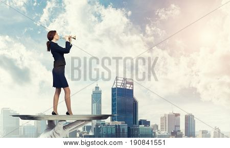 Hand of waiter presenting on tray woman playing fife