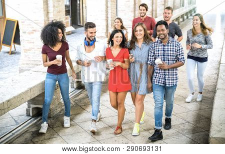 Multiracial Friends Group Walking In City Center - Happy Guys And Girls Having Fun Around Old Town S