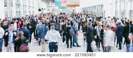 Crowd Of Anonymous Blurred People At A Trade Fair