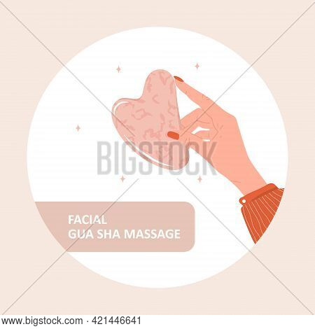 Gua Sha Scraper For Facial Massage. Female Hand Holding Natural Pink Quartz Stone. Trendy Beauty Tre