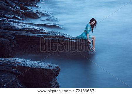 Beautiful young woman on sea