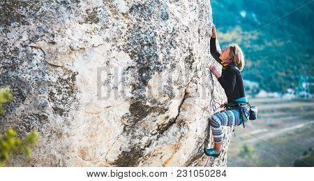 The Girl Climbs The Rock.