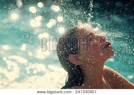 Woman Face Beauty. Maldives Or Miami Beach Water. Beauty Of Woman Is Moisturized In Bath. Cute Woman