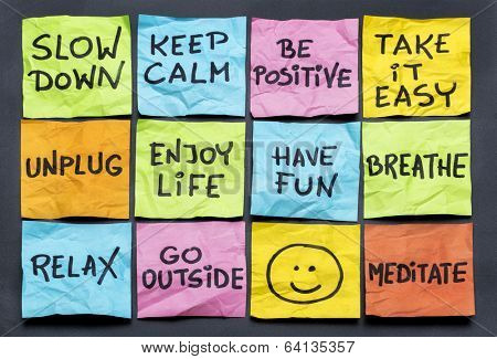 slow down, relax, take it easy, keep calm and other motivational  lifestyle reminders on colorful sticky notes