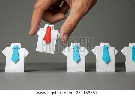 Choosing Good Employee Leader. Man Chooses And Takes In The Hand An Employee In Shirt And Red Tie. S