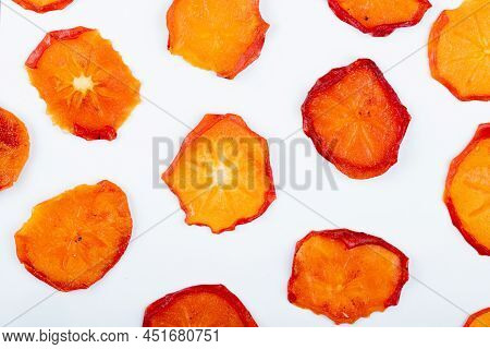 Top View Of Dried Persimmon Slices Isolated On White Background