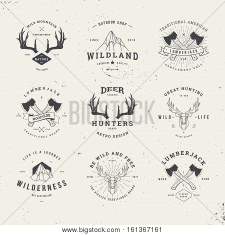 wildlife hunters hipster logo set with deer antlers axe and mountains