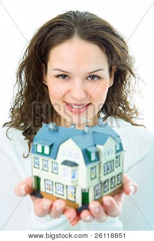 woman with little house in hand om white background