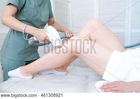 Body Care. Legs Laser Hair Removal. Costume Removes Hair Young Womans Leg. Laser Hair Removal Treatm