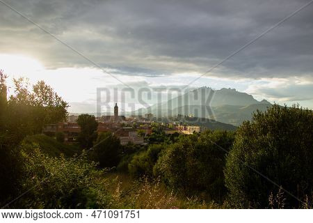 View Of A Esparreguera Town At Sunset, With Montserrat In The Background.