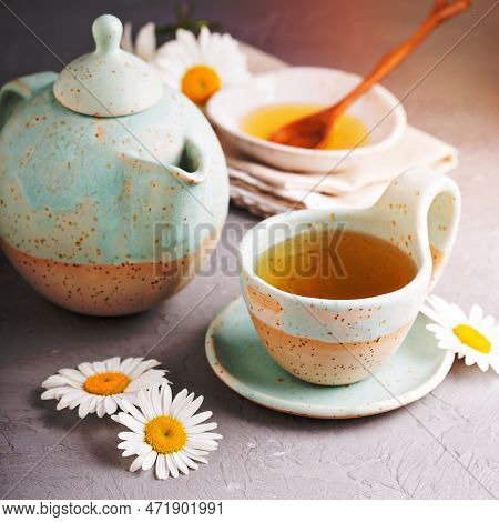 Hot Camomille Tea With Honey In Handmade Ceramic Cup