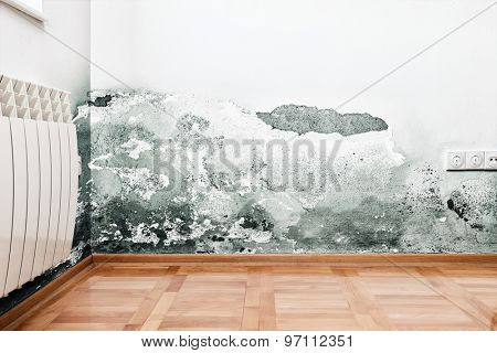 Mold and moisture buildup on wall of a modern house