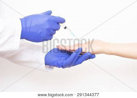 The Doctor Makes A Shot Of Botulinum Toxin In The Hand Of The Girls Palm Against Excessive Sweating,