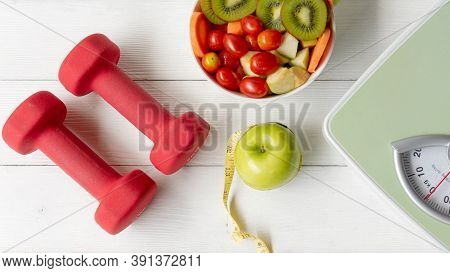 Diet Healthy Food And Lifestyle Health Concept. Sport Exercise Equipment Workout and gym Background 