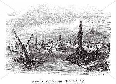 Jeddah or Jiddah or Jidda or Jedda in Saudi Arabia, during the 1890s, vintage engraving. Old engraved illustration of Jeddah with moving boats in front.  Trousset encyclopedia (1886 - 1891).