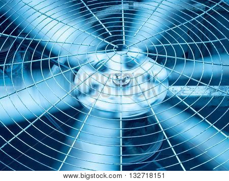 Blue tone of HVAC (Heating Ventilation and Air Conditioning) spining blades / Closeup of ventilator / Industrial ventilation fan background / Air Conditioner Ventilation Fan / Ventilation system