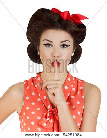 Pin-up Style Girl With Finger On Lips