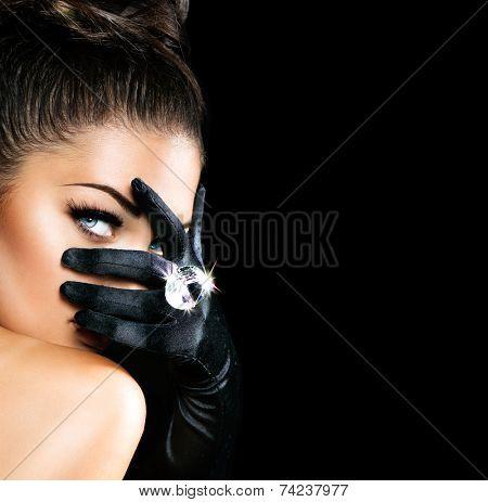 Beauty Fashion Glamorous Model Girl Portrait. Vintage Style Mysterious Woman Wearing black Glamour Gloves. Jewellery. Jewelry. Holiday Hairstyle and Make-up. Diamond Ring. Retro Lady with Blue Eyes 